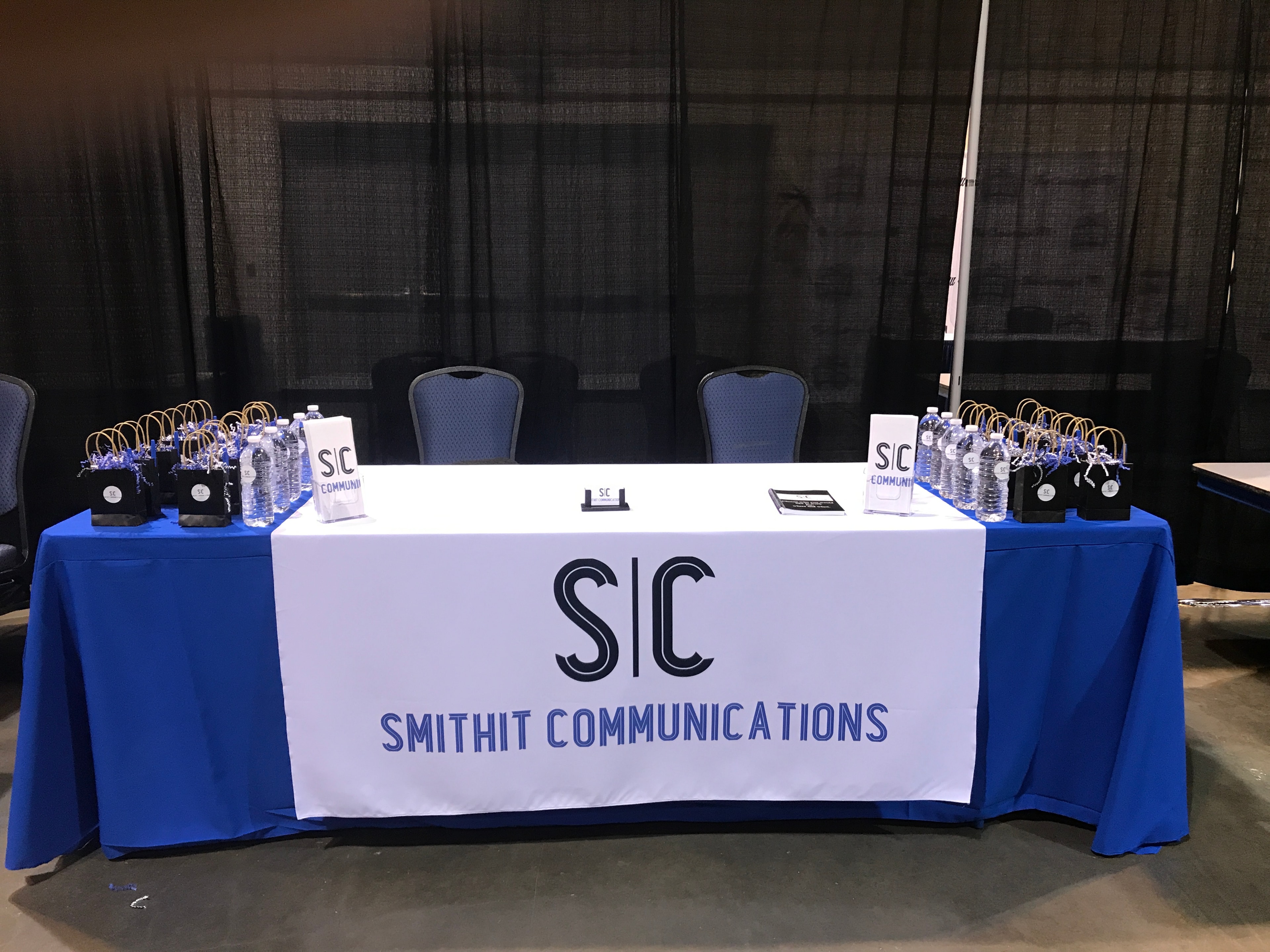 Smithit Communications representatives engaging with job fair attendees